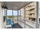Screened balcony overlooking the ocean and community pool at 4303 S Ocean Blvd. # 107, North Myrtle Beach, SC 29582