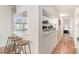 Open kitchen with breakfast bar and view into living room at 4303 S Ocean Blvd. # 107, North Myrtle Beach, SC 29582