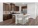 Modern kitchen with island and stainless steel appliances at 782 Cypress Preserve Circle, Longs, SC 29568