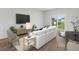 Living room with sofa, chairs, and access to backyard at 782 Cypress Preserve Circle, Longs, SC 29568