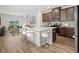 Modern kitchen with island and stainless steel appliances at 782 Cypress Preserve Circle, Longs, SC 29568
