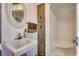 Small bathroom with a sink, shower, and built-in storage at 4612 Red Bluff Rd., Loris, SC 29569