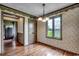 Bright dining room with hardwood floors and floral wallpaper at 4612 Red Bluff Rd., Loris, SC 29569