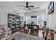 Bright home office with built-in shelving, hardwood floors, and a ceiling fan at 312 West Palms Dr., Myrtle Beach, SC 29579