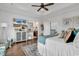 Main bedroom with hardwood floors, large windows, and a ceiling fan at 312 West Palms Dr., Myrtle Beach, SC 29579
