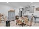 Charming basement kitchen with gray cabinets, round table, and floral tablecloth at 312 West Palms Dr., Myrtle Beach, SC 29579