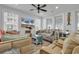 Cozy living room featuring a daybed, comfortable seating, and a large TV at 312 West Palms Dr., Myrtle Beach, SC 29579