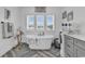 Bathroom with freestanding tub and herringbone tile floor at 312 West Palms Dr., Myrtle Beach, SC 29579