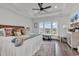 Spacious main bedroom with high ceilings, large windows, and a ceiling fan at 312 West Palms Dr., Myrtle Beach, SC 29579