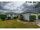 Charming single-story home with attached garage and manicured lawn at 213 Birkdale Ln., Myrtle Beach, SC 29588