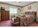 Cozy bedroom featuring a double bed, dresser, and window at 213 Birkdale Ln., Myrtle Beach, SC 29588