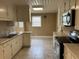 Kitchen with white cabinets, stainless steel appliances, and tile floor at 880 Horry Rd., Aynor, SC 29511