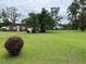 Brick ranch house with a spacious lawn and mature trees at 880 Horry Rd., Aynor, SC 29511