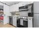 Modern kitchen features stainless steel appliances and white shaker cabinets at 6001 - N-45 S Kings Hwy., Myrtle Beach, SC 29575