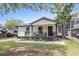 House exterior with front porch, landscaping, and driveway at 6001 - N-45 S Kings Hwy., Myrtle Beach, SC 29575