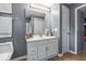 Bathroom with a white vanity and a large mirror at 6001 - N-45 S Kings Hwy., Myrtle Beach, SC 29575