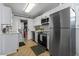 Modern kitchen featuring stainless steel appliances and white cabinetry at 6001 - N-45 S Kings Hwy., Myrtle Beach, SC 29575