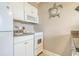 Small kitchen with white cabinets and appliances at 6900 Ocean Blvd. N # 1205, Myrtle Beach, SC 29572