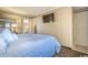 Main bedroom with a king bed and ensuite access at 6900 Ocean Blvd. N # 1205, Myrtle Beach, SC 29572