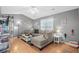 Cozy living room features L-shaped sofa, hardwood floors, and coastal decor at 6001 - 1550 S Kings Hwy., Myrtle Beach, SC 29575