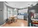 Bright kitchen with white cabinets, stainless steel appliances, and a breakfast nook at 6001 - 1550 S Kings Hwy., Myrtle Beach, SC 29575