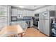 Well-equipped kitchen featuring stainless steel appliances and white cabinetry at 6001 - 1550 S Kings Hwy., Myrtle Beach, SC 29575