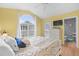 Bright bedroom with a king-size bed and access to balcony at 6001 - 1550 S Kings Hwy., Myrtle Beach, SC 29575