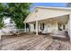 Deck with wooden swing, picnic table, and seating area at 6001 - 1550 S Kings Hwy., Myrtle Beach, SC 29575