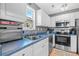 Clean kitchen with stainless steel appliances and blue countertops at 6001 - 1550 S Kings Hwy., Myrtle Beach, SC 29575