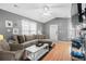 Living room with L-shaped sofa, hardwood floors, and coastal decor at 6001 - 1550 S Kings Hwy., Myrtle Beach, SC 29575