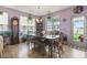 Bright dining room features a spacious table, bench seating, and large windows at 5188 Country Pine Dr., Myrtle Beach, SC 29579
