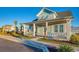 Charming light teal house with front porch and landscaping at 8165 Living Tide Dr., Myrtle Beach, SC 29572