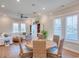 Casual dining area with round table and wicker chairs, adjacent to living room at 8165 Living Tide Dr., Myrtle Beach, SC 29572