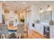 Bright dining area with a round wooden table and wicker chairs at 8165 Living Tide Dr., Myrtle Beach, SC 29572