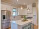 Bright kitchen with white cabinets, stainless steel appliances, and island at 8165 Living Tide Dr., Myrtle Beach, SC 29572