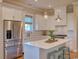 Bright kitchen with white cabinets, stainless steel appliances, and island at 8165 Living Tide Dr., Myrtle Beach, SC 29572