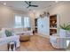 Bright living room featuring comfy seating, built-in shelving, and hardwood floors at 8165 Living Tide Dr., Myrtle Beach, SC 29572