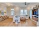 Spacious living room featuring a comfy sectional sofa and a large TV at 8165 Living Tide Dr., Myrtle Beach, SC 29572