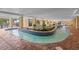 Indoor lazy river style pool with landscaping and seating at 1200 N Ocean Blvd. # 1002, Myrtle Beach, SC 29577