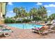Outdoor pool with lounge chairs and umbrellas at 1200 N Ocean Blvd. # 1002, Myrtle Beach, SC 29577