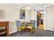 Condo dining area with table for four and kitchen view at 1200 N Ocean Blvd. # 1002, Myrtle Beach, SC 29577