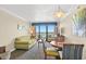 Condo living room with ocean view and seating for four at 1200 N Ocean Blvd. # 1002, Myrtle Beach, SC 29577