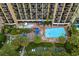 Aerial view showing multiple pools, and building at 1200 N Ocean Blvd. # 1002, Myrtle Beach, SC 29577