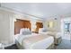 Two twin beds in a well-lit bedroom at 1200 N Ocean Blvd. # 1002, Myrtle Beach, SC 29577