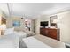 Bedroom with two twin beds and adjacent kitchenette at 1200 N Ocean Blvd. # 1002, Myrtle Beach, SC 29577