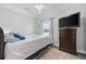Cozy bedroom with a dresser, TV, and comfortable bedding at 4503 W Harbour Circle # S1, Little River, SC 29566