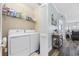 Convenient laundry room with washer, dryer, and shelving at 4503 W Harbour Circle # S1, Little River, SC 29566