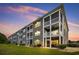 Three-story building with screened balconies and lake views at 4503 W Harbour Circle # S1, Little River, SC 29566