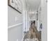 Bright hallway with wood-look floors and access to rooms at 4503 W Harbour Circle # S1, Little River, SC 29566