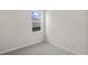 Simple bedroom with neutral walls and carpeting, featuring a window at 3050 Deerberry Place, Longs, SC 29568